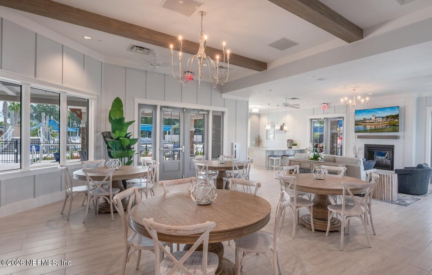 434 Cedar Elm Way St. Augustine, FL 32092 - Photo 27 of 27 a view of a dining room with furniture window and outside view