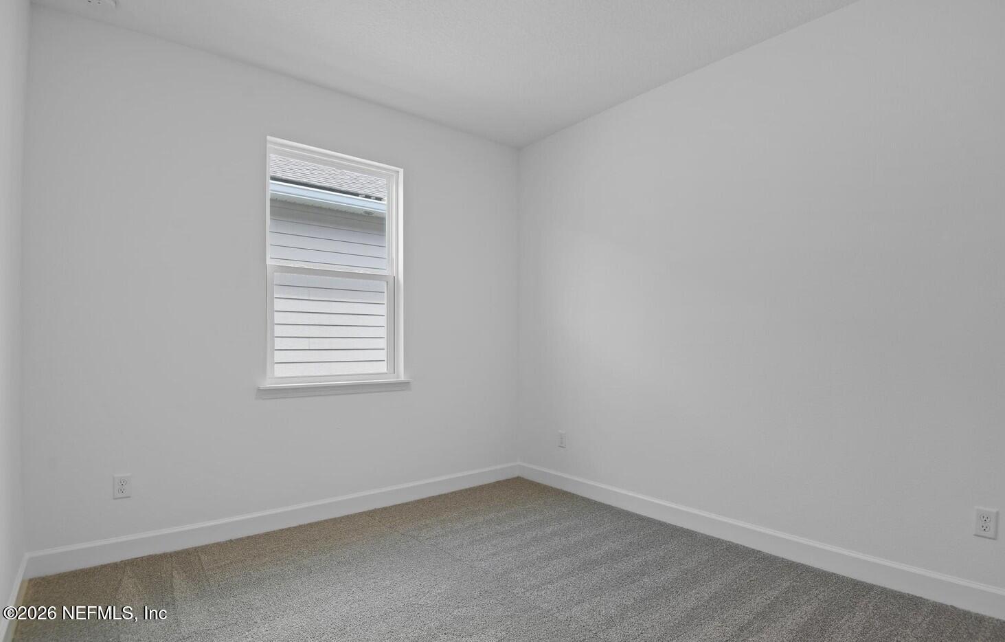 434 Cedar Elm Way St. Augustine, FL 32092 - Photo 10 of 27 an empty room with a window