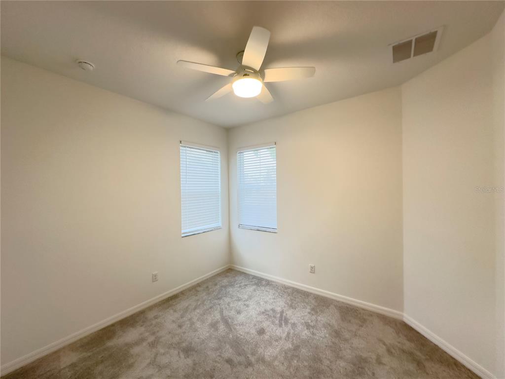 17937 Cherished Loop Lakewood Ranch, FL 34211 - Photo 11 of 30 an empty room with a ceiling fan and a window