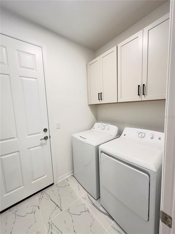 17937 Cherished Loop Lakewood Ranch, FL 34211 - Photo 20 of 30 a view of storage and utility room with washer and dryer