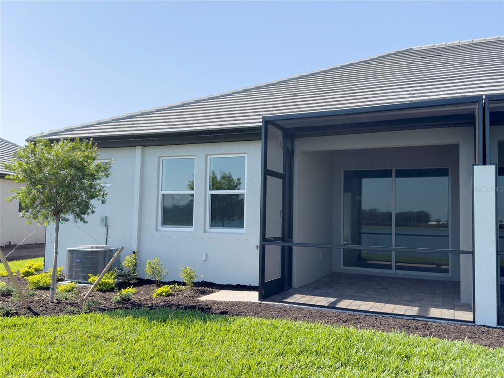 17937 Cherished Loop Lakewood Ranch, FL 34211 - Photo 22 of 30 a backyard of a house with seating space