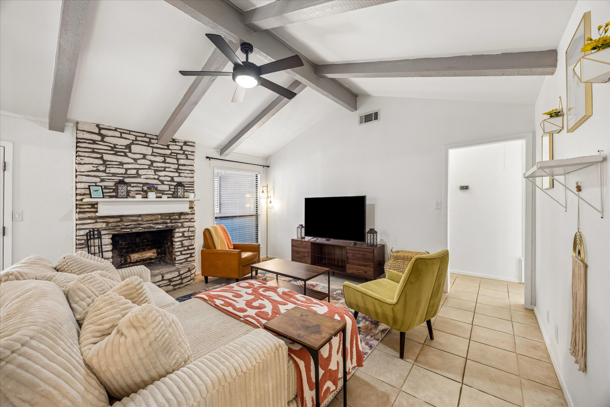 908 Riddlewood Drive Austin, TX 78753 - Photo 2 of 21 Fully furnished living room with fireplace