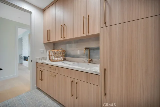 a bathroom with a granite countertop double vanity sinks and a mirror
