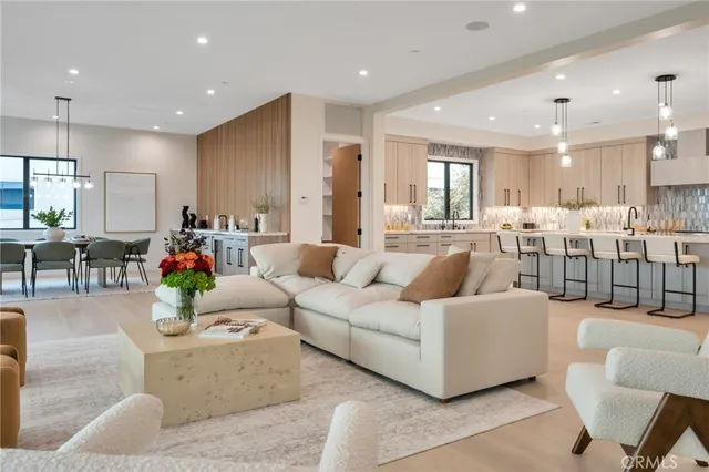a kitchen with counter top space a sink stainless steel appliances and cabinets