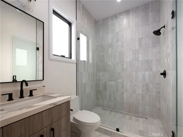 a view of a patio with couches and pool