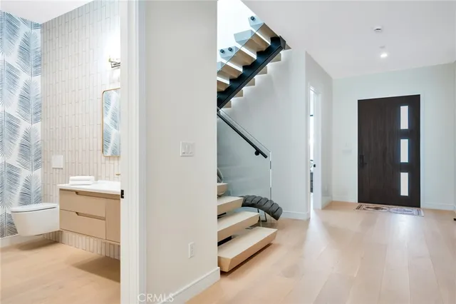 a bathroom with a sink a toilet and tub