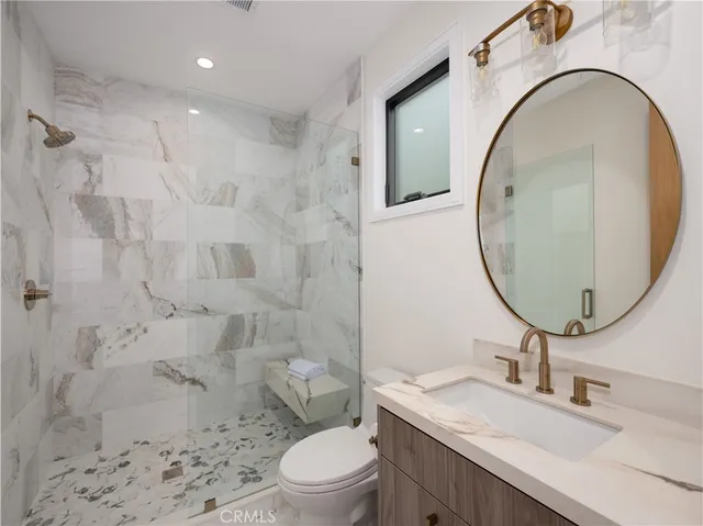 a bedroom with bed and a couch