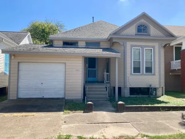 a front view of a house with garage