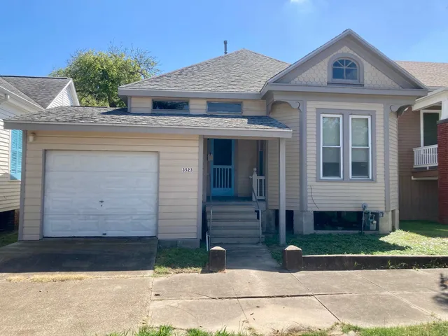 a front view of a house with garage