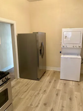 a view of a storage & utility room with a washer dryer