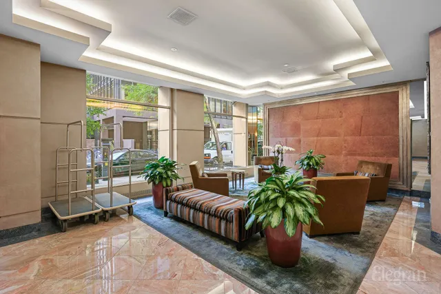 a kitchen with stainless steel appliances granite countertop a stove and a white refrigerator with a large window