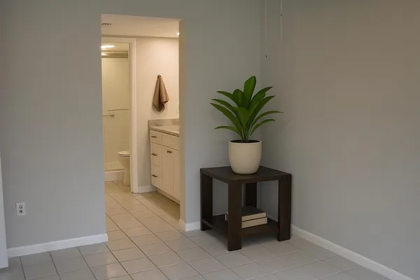 a view of entryway with paintings on the wall