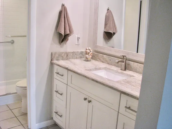 a bathroom with a double vanity sink and mirror