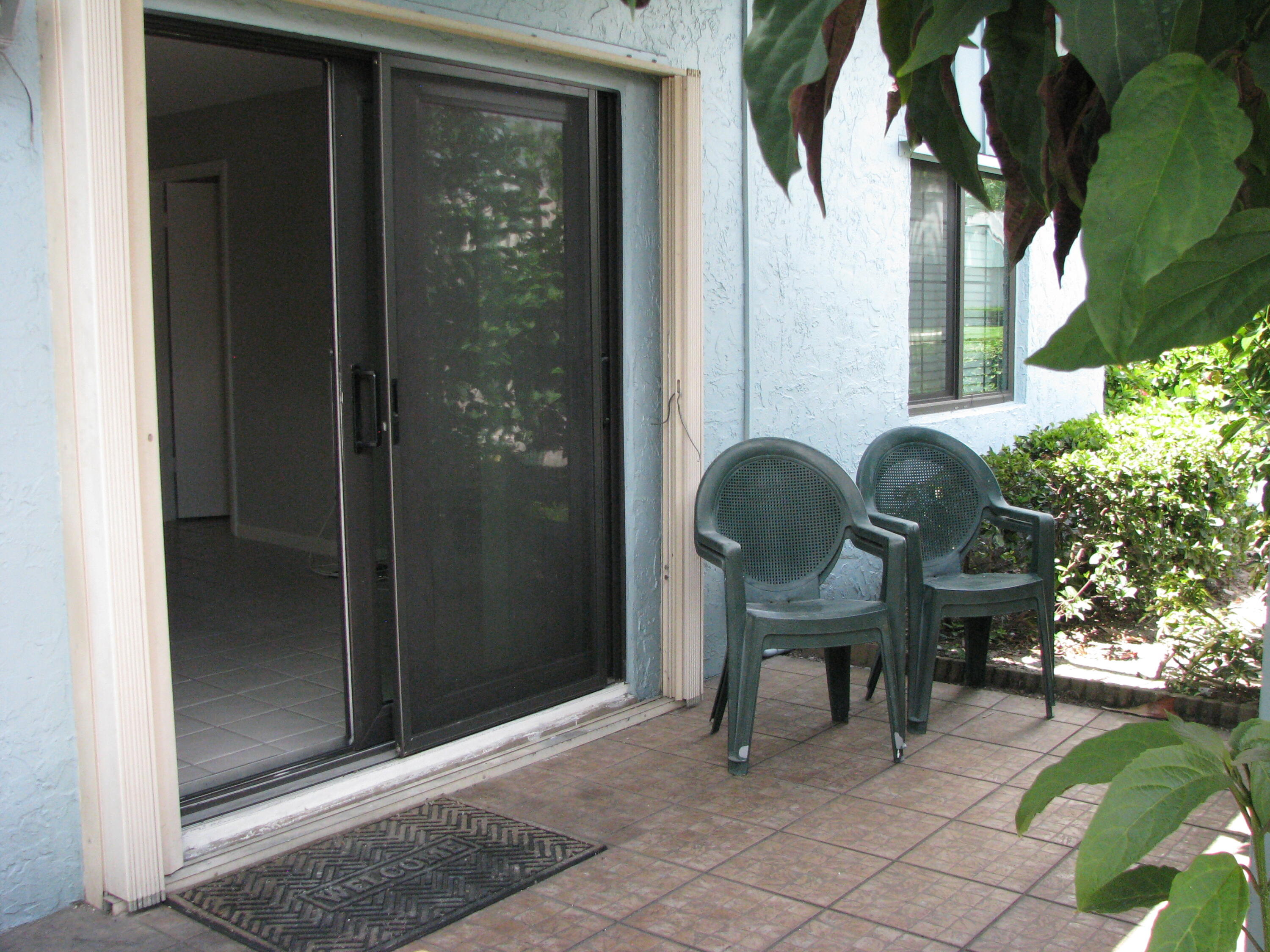 950 South Kanner Highway, Unit D4 Stuart, FL 34994 - Photo 23 of 36 a view of a chair and table in front of house