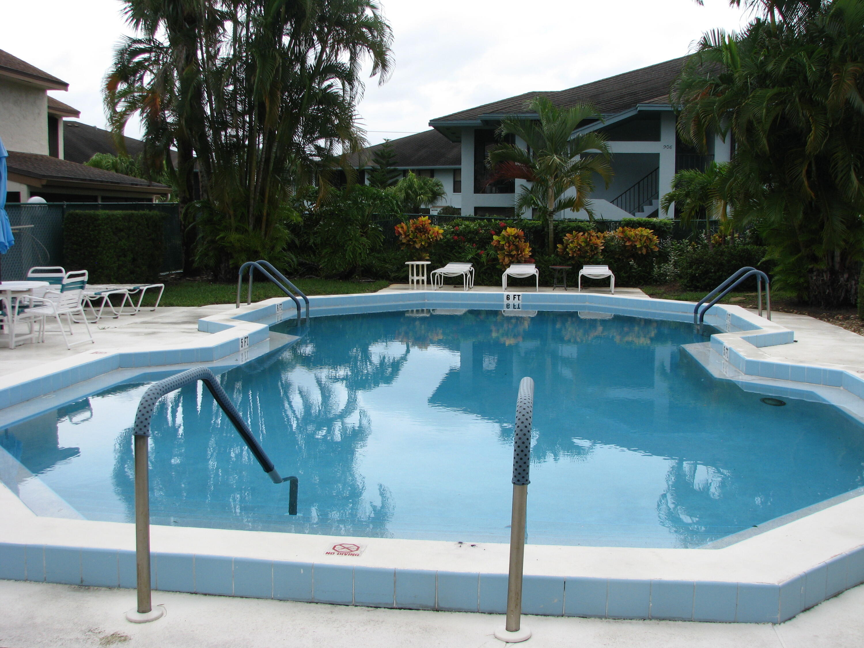 950 South Kanner Highway, Unit D4 Stuart, FL 34994 - Photo 29 of 36 a view of a swimming pool with sitting area