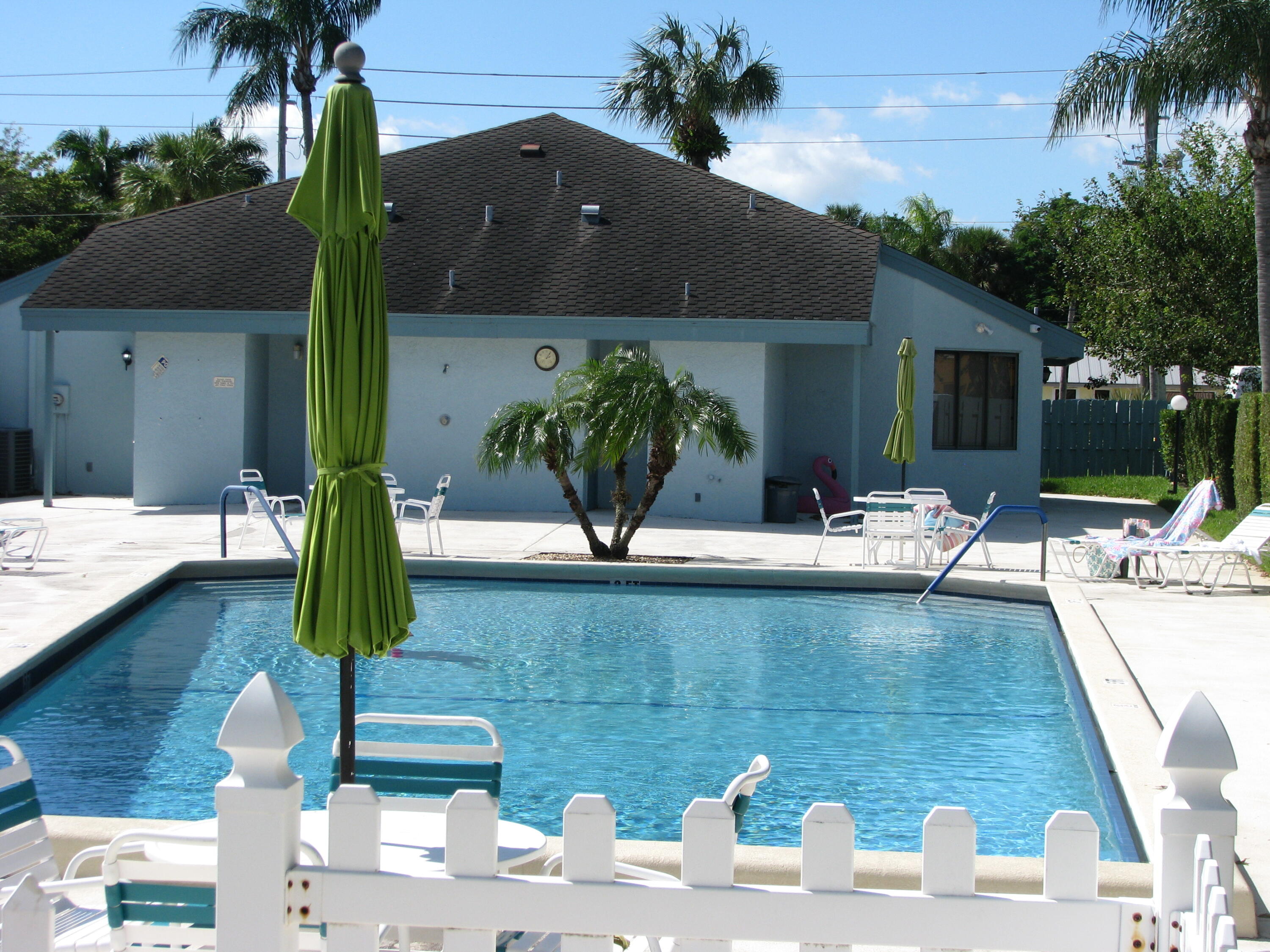 950 South Kanner Highway, Unit D4 Stuart, FL 34994 - Photo 30 of 36 a view of a house with a swimming pool