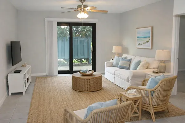 a living room with furniture and a flat screen tv