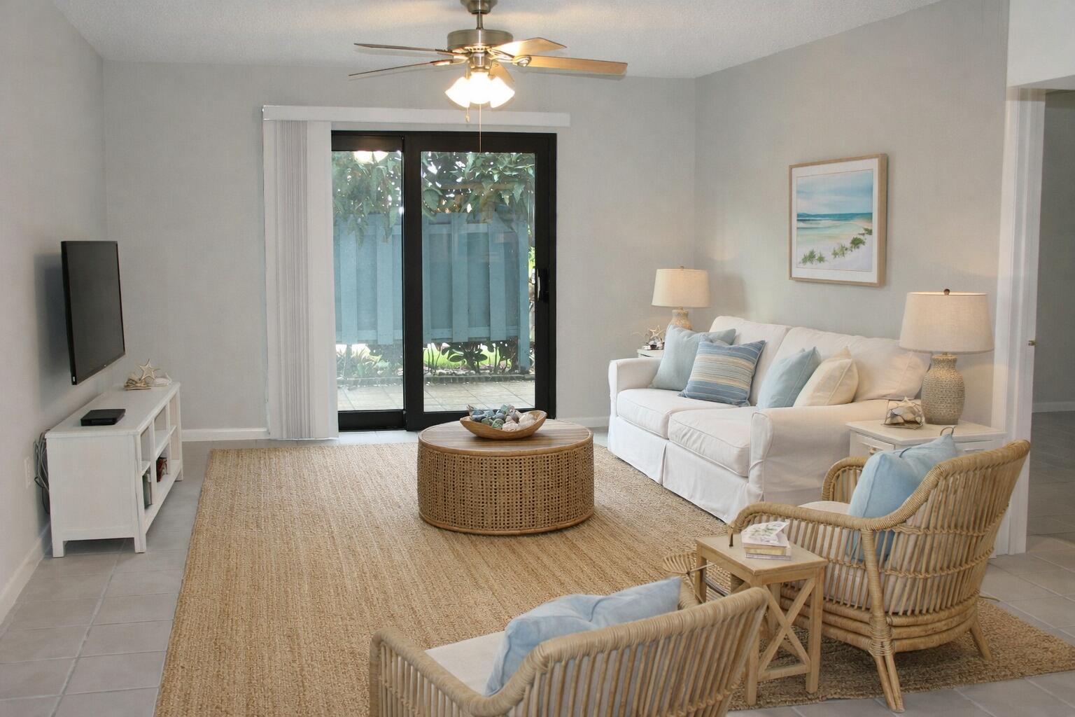 950 South Kanner Highway, Unit D4 Stuart, FL 34994 - Photo 7 of 36 a living room with furniture and a flat screen tv