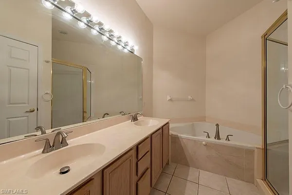 a bathroom with a sink double vanity and a mirror