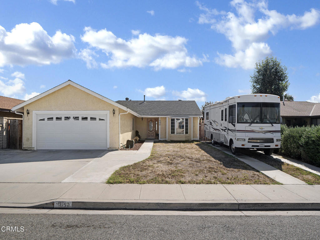 1050 King Street Fillmore, CA 93015 - Photo 1 of 1 a front view of a house with a yard and garage