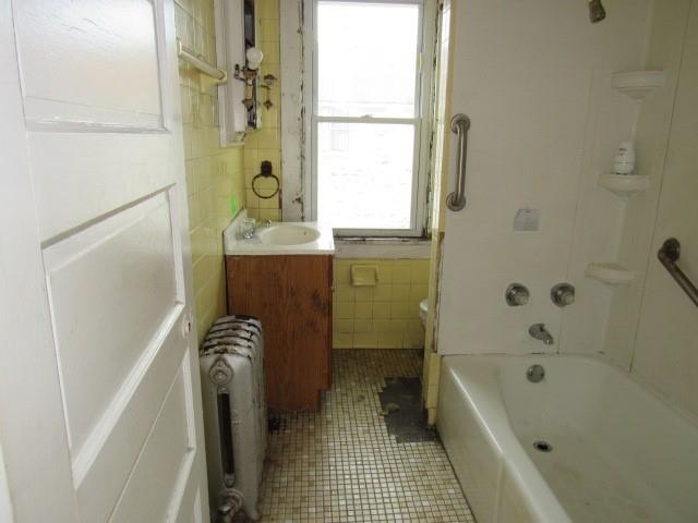 1000 Davis Street Aliquippa, PA 15001 - Photo 11 of 19 a bathroom with a bathtub a sink and a shower