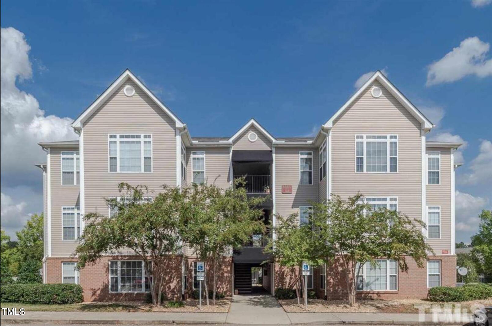 2501 Huntscroft Lane, Unit 200 Raleigh, NC 27617 - Photo 1 of 8 a view of a house and a yard