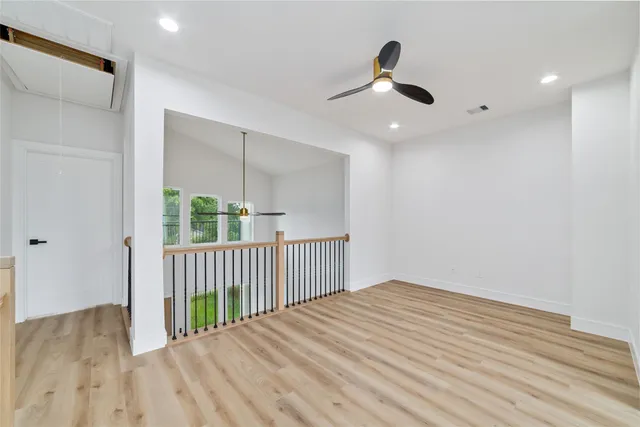 a view of a room with wooden floor