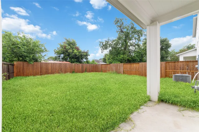 a view of backyard with garden and garage