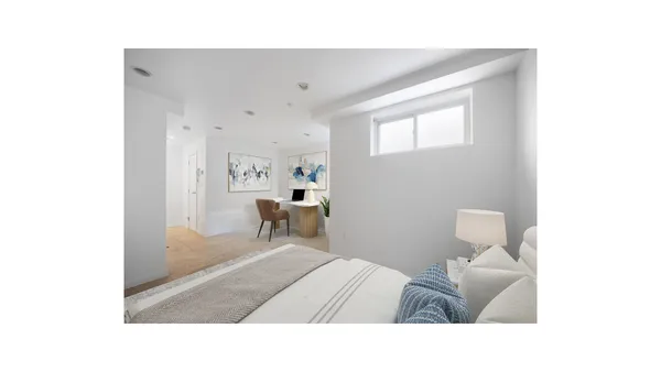 a living room with furniture and a chair