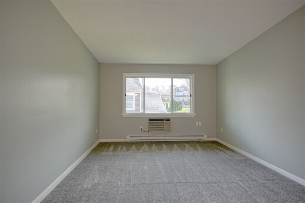 74 Beach Street, Unit 112 Woburn, MA 01801 - Photo 8 of 9 an empty room with a window