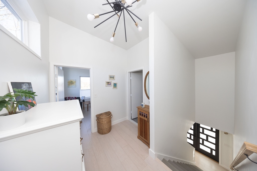 19 Sandy Bar Drive Worcester, MA 01604 - Photo 27 of 42 a room with a chandelier furniture and white walls