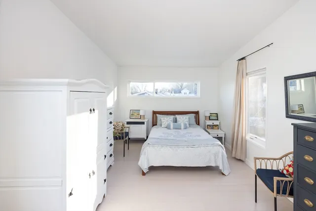a view of a livingroom with furniture and a window