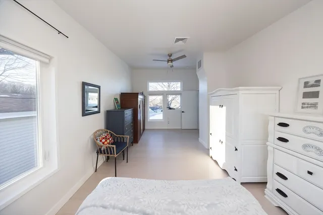 a view of cabinet with a chair