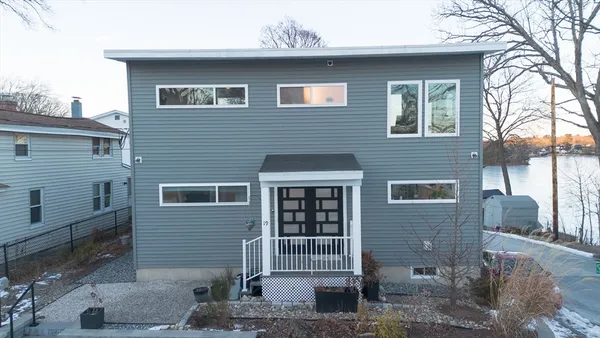 a front view of a house with stairs