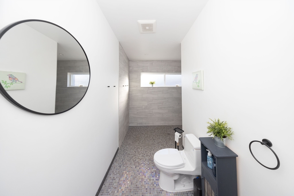 19 Sandy Bar Drive Worcester, MA 01604 - Photo 33 of 42 a bathroom with a toilet sink and mirror