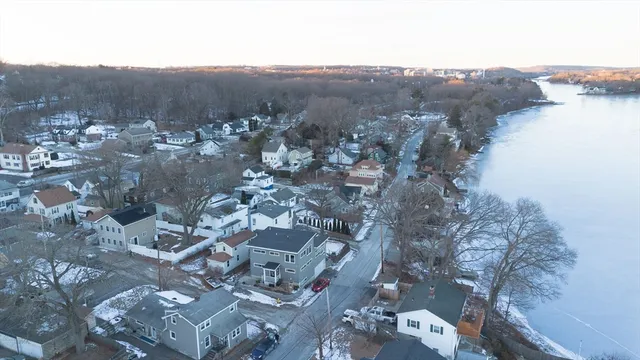 an aerial view of house with mountain view