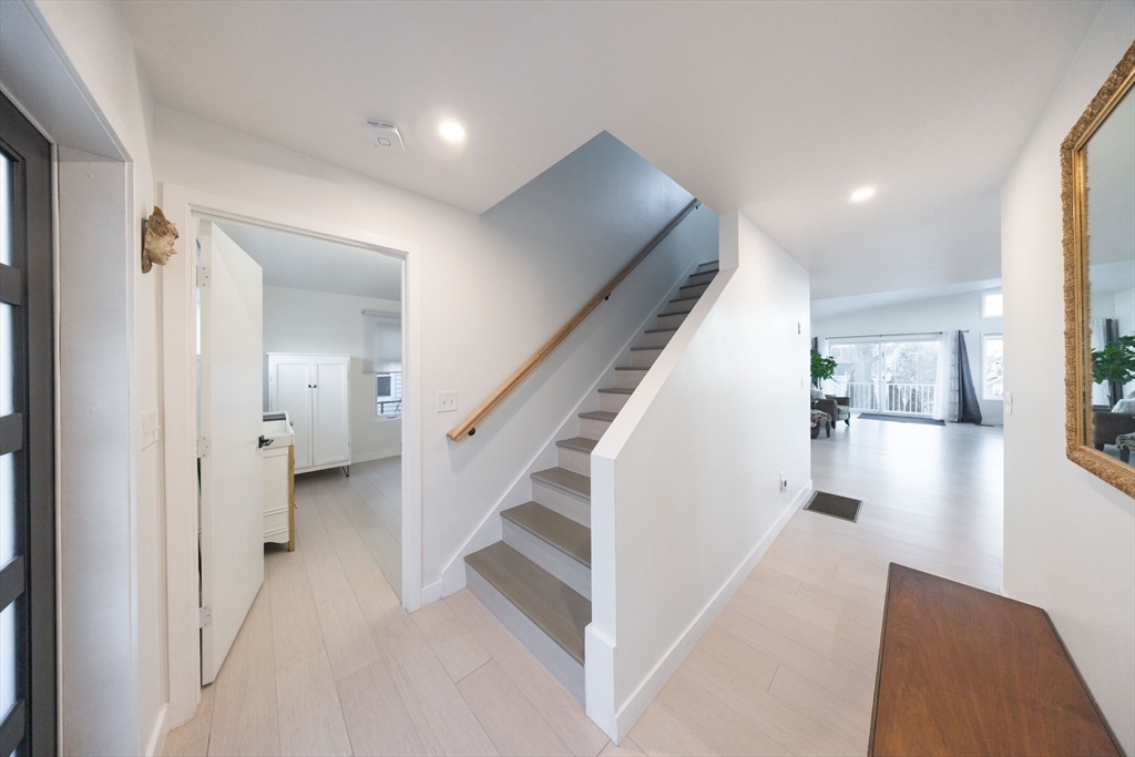 19 Sandy Bar Drive Worcester, MA 01604 - Photo 10 of 42 a view of a hallway with white walls and stairs