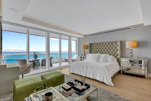 a bedroom with a bed and a couch