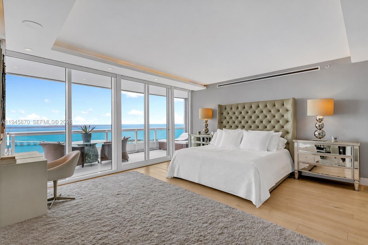 1643 Brickell Avenue, Unit 3904 Miami, FL 33129 - Photo 13 of 26 a spacious bedroom with a bed and a large window with balcony view