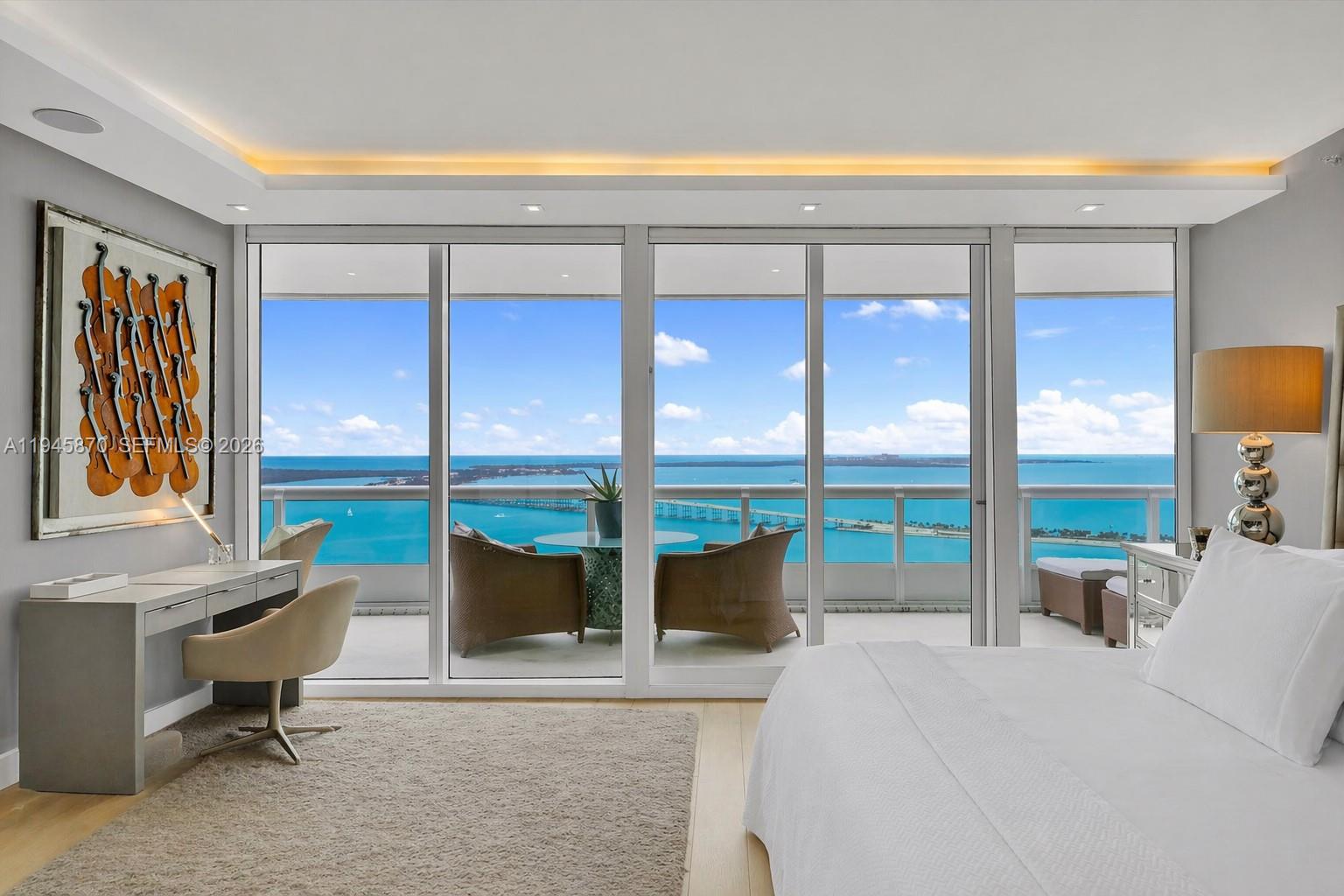 1643 Brickell Avenue, Unit 3904 Miami, FL 33129 - Photo 14 of 26 a living room with a large window and a table