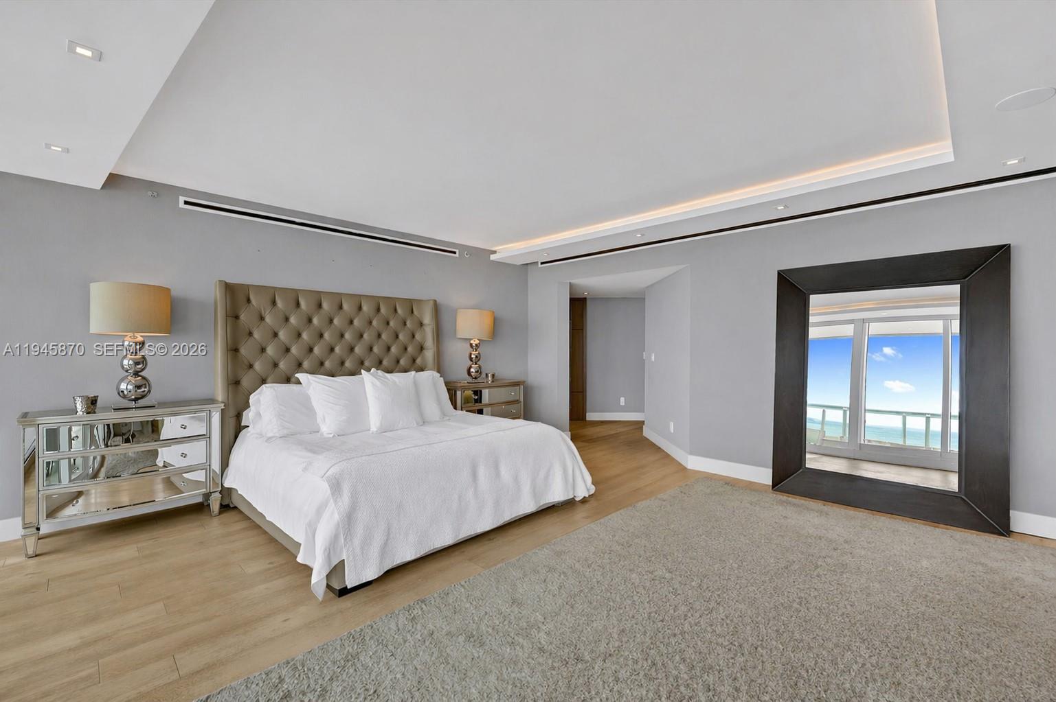 1643 Brickell Avenue, Unit 3904 Miami, FL 33129 - Photo 15 of 26 a bedroom with a bed and a lamp