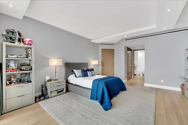 a bedroom with a bed and closet