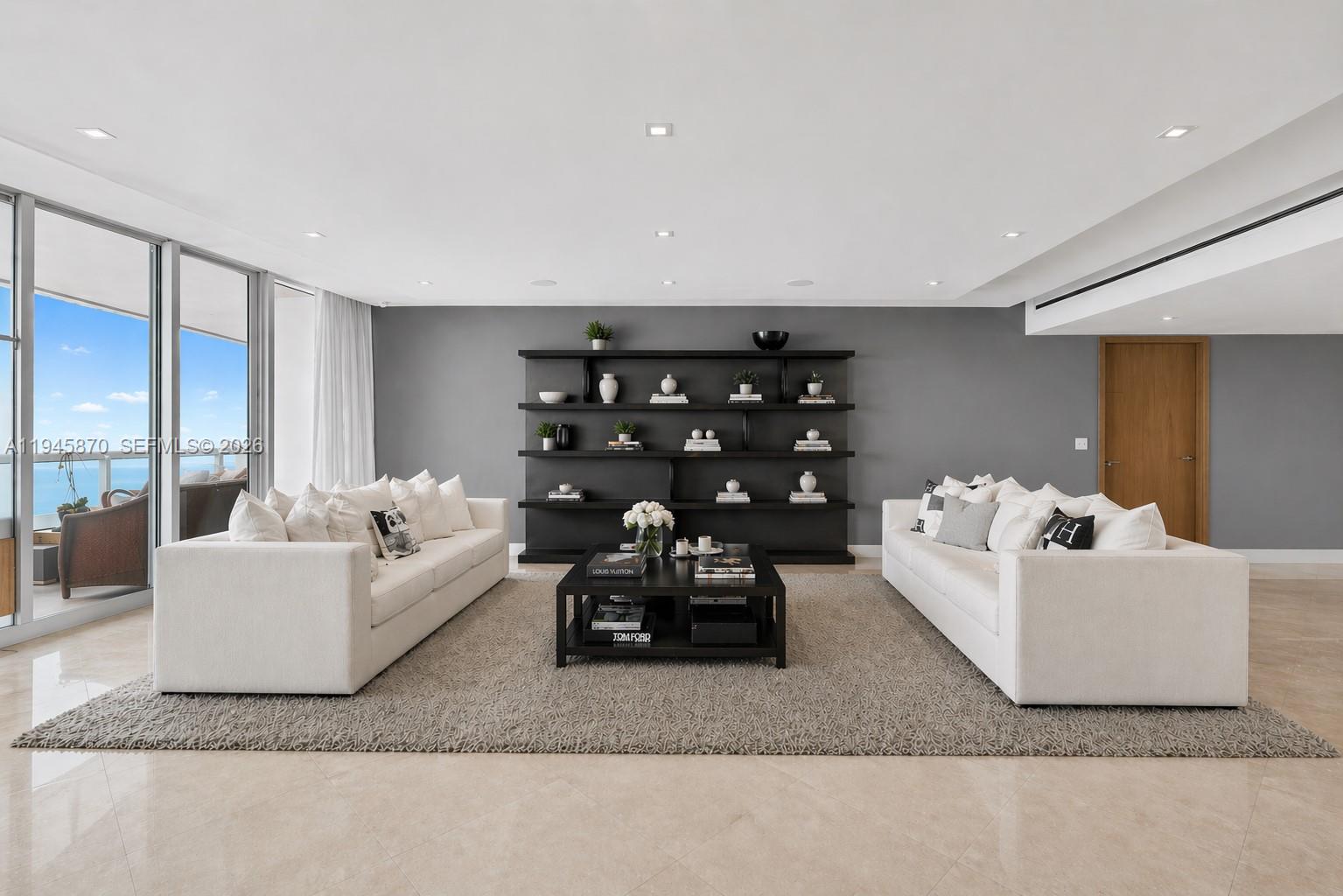 1643 Brickell Avenue, Unit 3904 Miami, FL 33129 - Photo 3 of 26 a living room with furniture and a large window