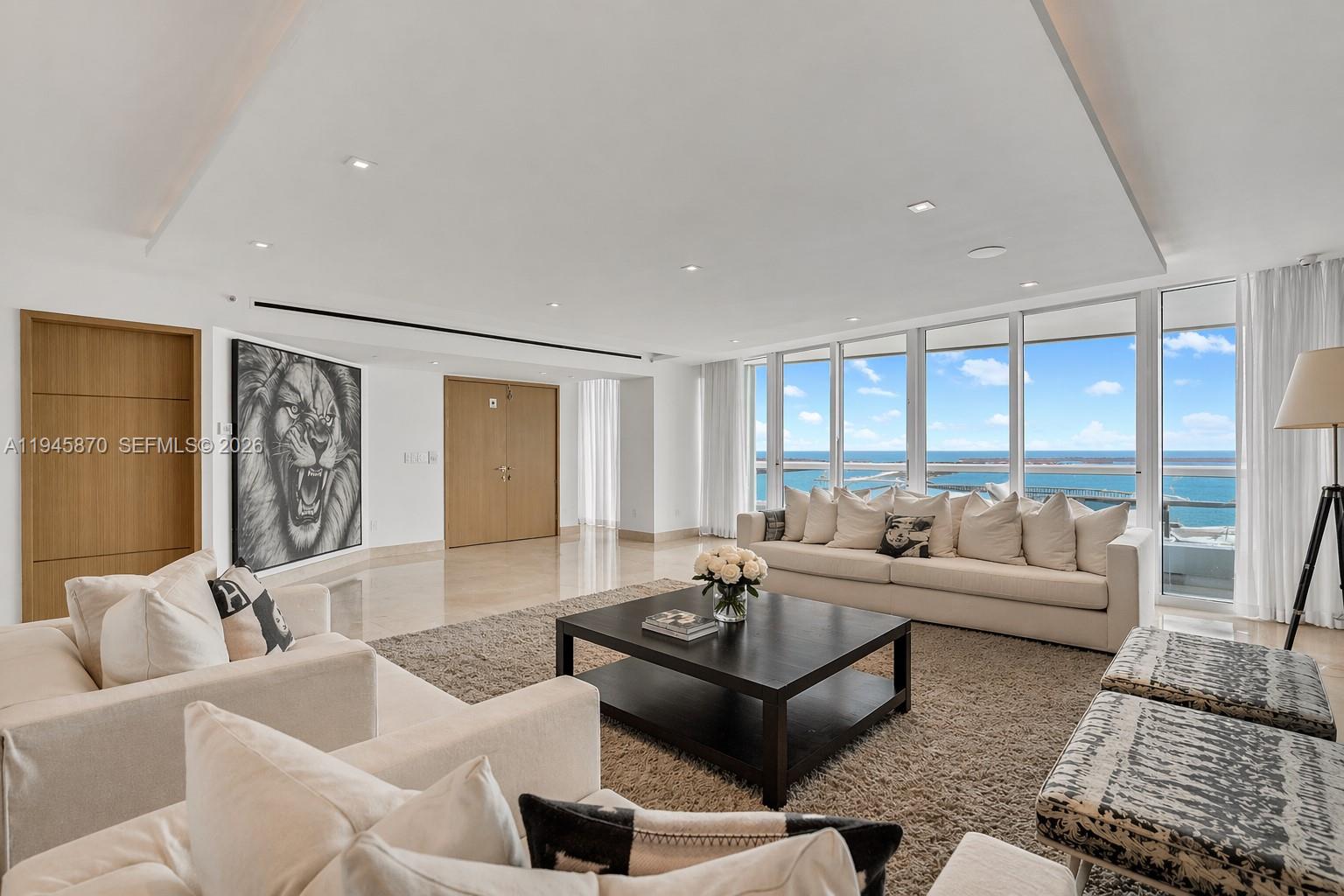 1643 Brickell Avenue, Unit 3904 Miami, FL 33129 - Photo 5 of 26 a living room with furniture and a large window