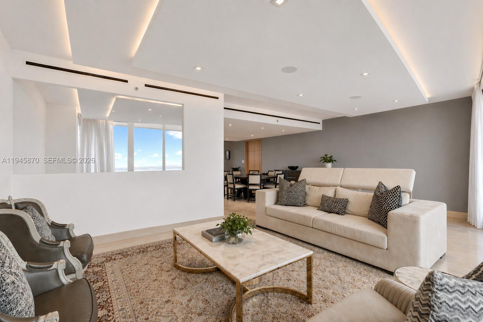1643 Brickell Avenue, Unit 3904 Miami, FL 33129 - Photo 9 of 26 a living room with furniture and a rug