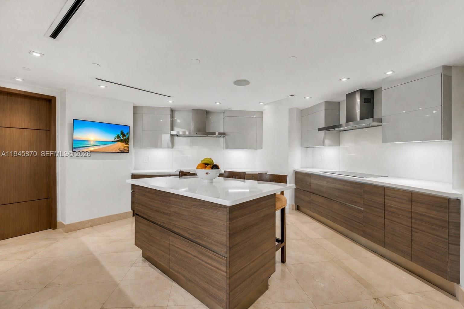 1643 Brickell Avenue, Unit 3904 Miami, FL 33129 - Photo 10 of 26 a kitchen with stainless steel appliances granite countertop a stove and a refrigerator