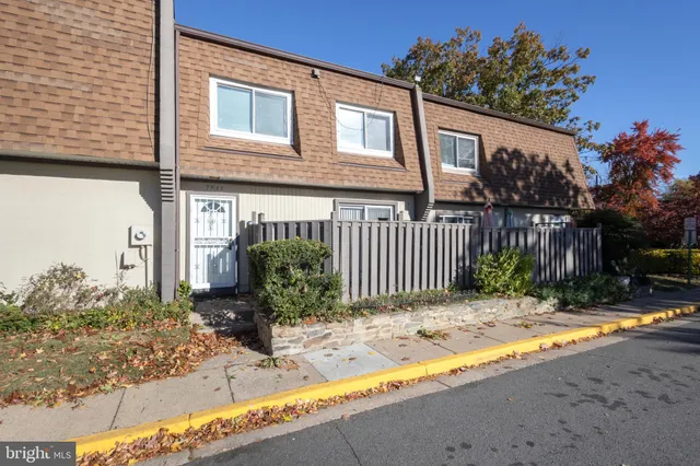 a backyard of a house with tree s