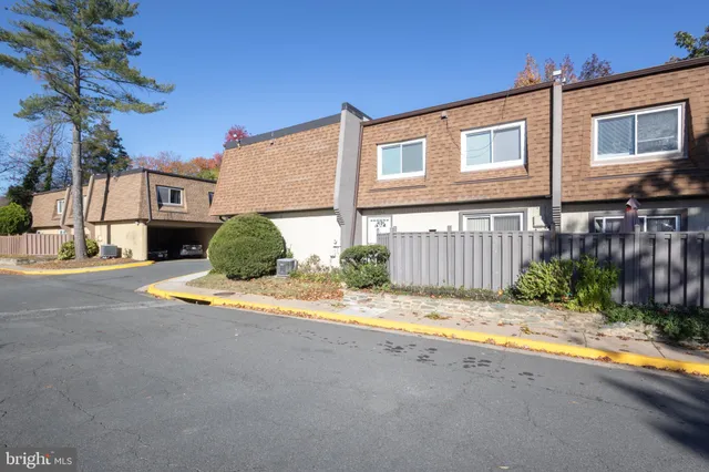 a view of the house with a yard and street view