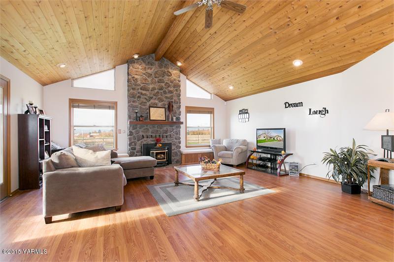 1350 Gilbert Road Zillah, WA 98953 - Photo 5 of 18 a living room with fireplace furniture and a large window