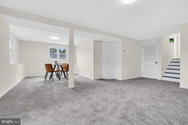 an empty room with furniture and windows